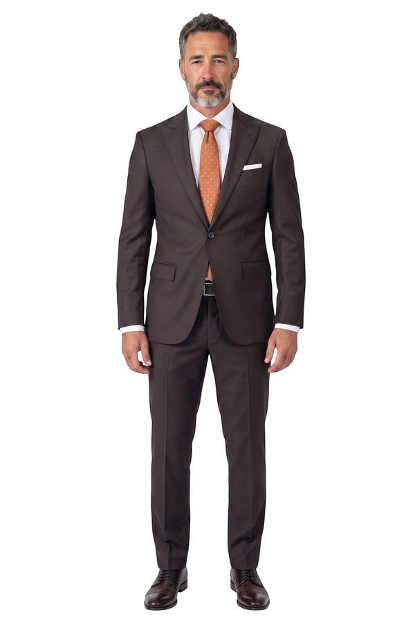 Model wearing a Cosiani slim fit brown wool and silk suit with a white shirt and orange tie against a white background